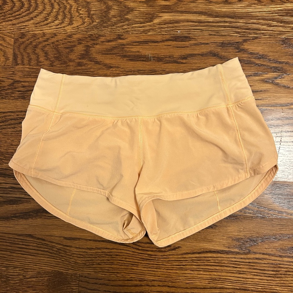 Lululemon 2.5 low rise speed up shorts- pastel orange - size 2 DISCONTINUED